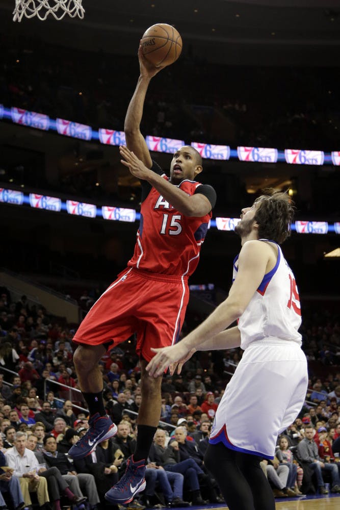 Atlanta Hawks' Al Horford, left, goes up for a shot against Philadelphia 76ers' Furkan Aldemir, of Turkey, during the second half of Atlanta's 105-87 win on Tuesday, Jan. 13 in Philadelphia.