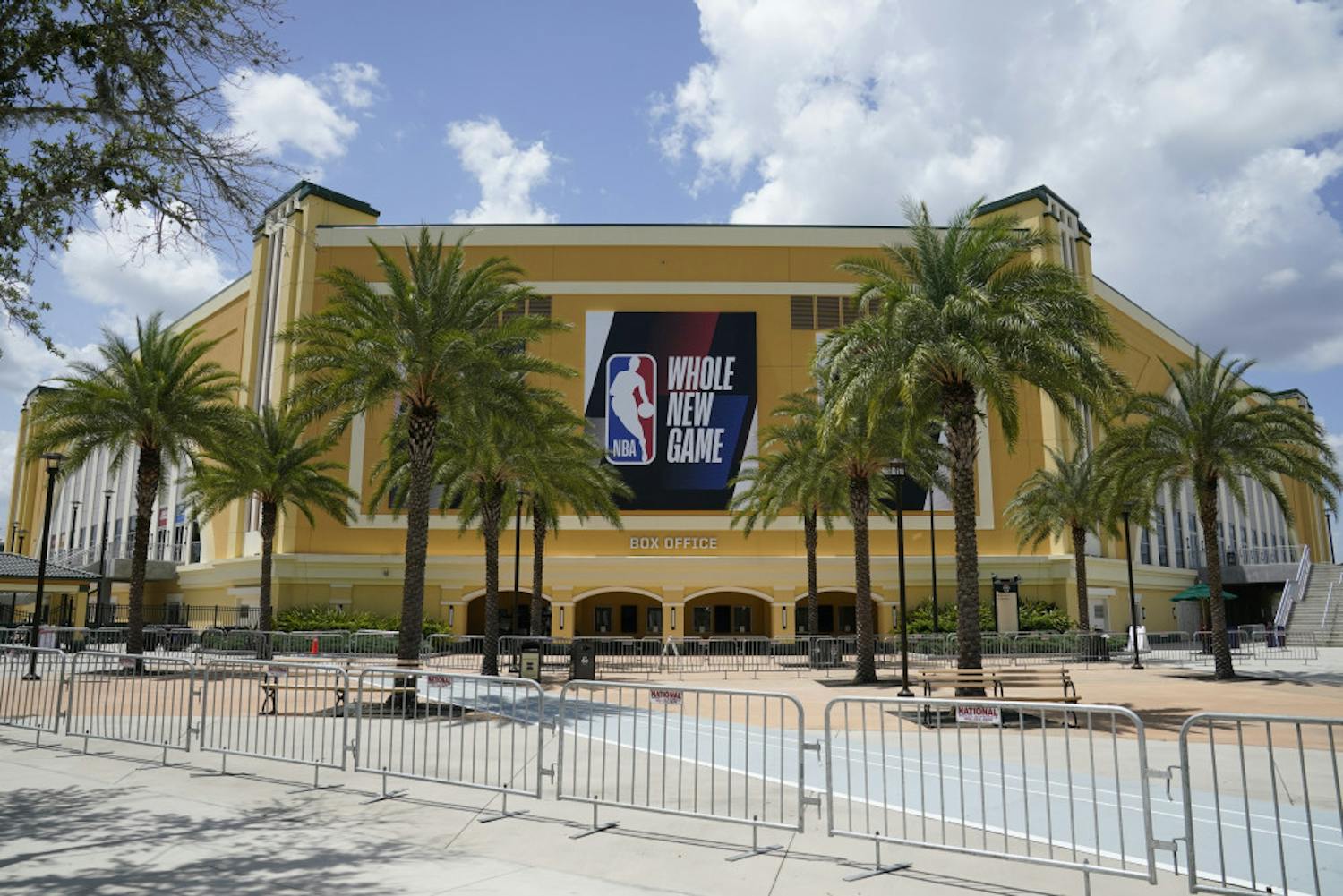 An NBA sign is posted on a basketball arena at ESPN Wide World of Sports Complex Wednesday, July 29, 2020, in Orlando, Fla. NBA games will resume Thursday. (AP Photo/Ashley Landis)
