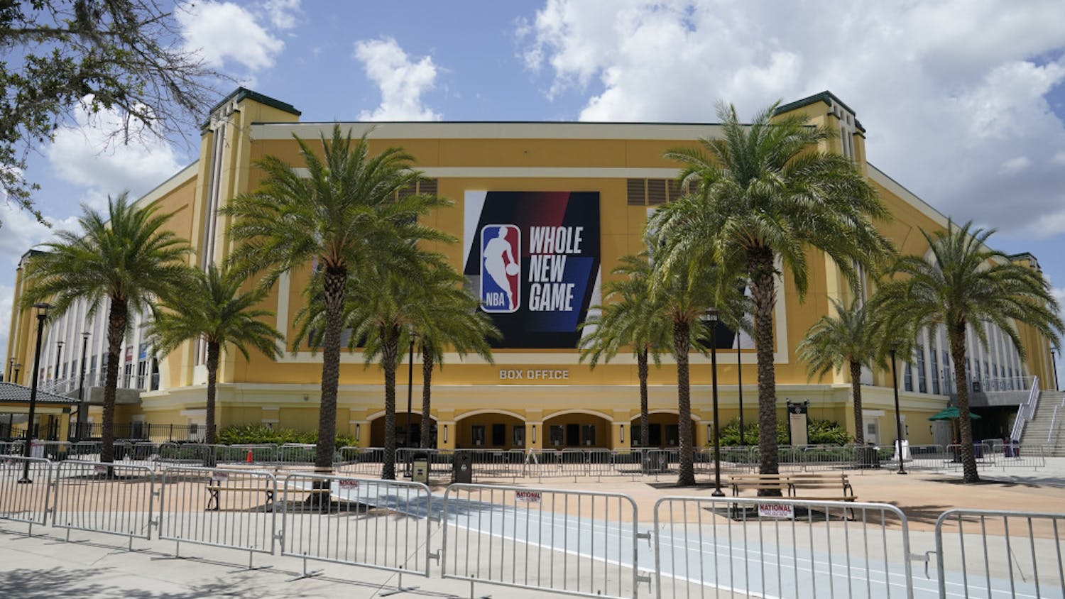 An NBA sign is posted on a basketball arena at ESPN Wide World of Sports Complex Wednesday, July 29, 2020, in Orlando, Fla. NBA games will resume Thursday. (AP Photo/Ashley Landis)