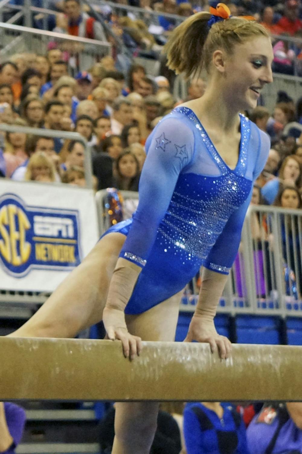 <p>Alex McMurtry performs her balance beam routine during Florida's win against Georgia on Jan. 30.</p>