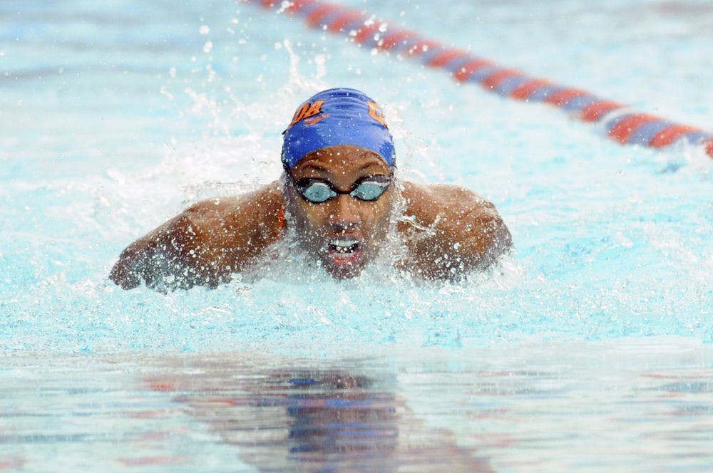 <p>Natalie Hinds races in the 100 meter butterfly during Florida’s meet against Auburn on Jan. 23, 2016, in the O’Connell Center.</p>