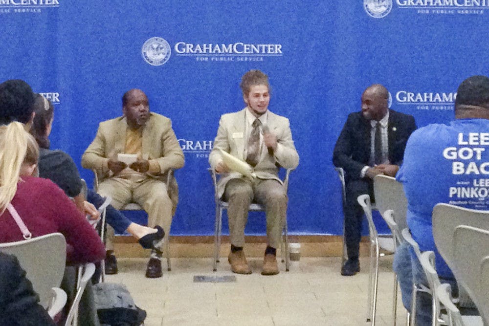 <p>From left: Scherwin Henry, Lucas Jewell and Chris Weaver, all candidates for city commissioner for District 1, speak to an audience at an open forum event hosted by UF College Democrats in Pugh Hall on Friday night.</p>