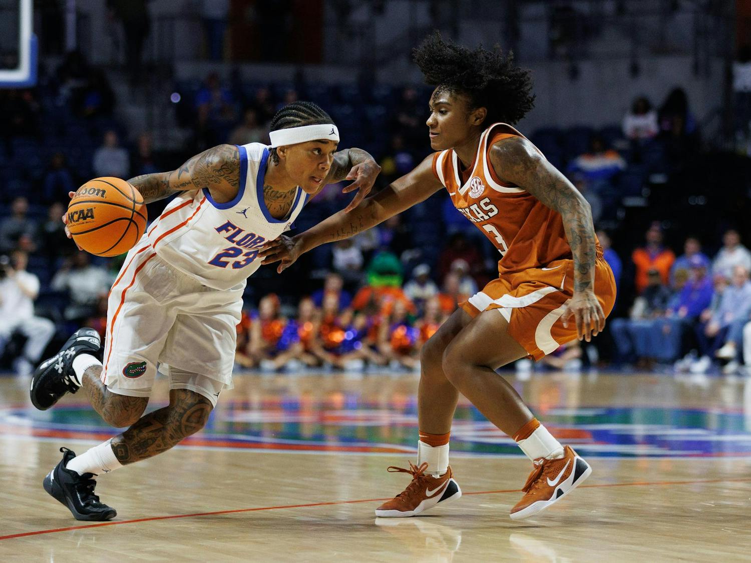 Florida guard Liv McGill (23) dribbles during the first half of an NCAA basketball game against Texas, Thursday, Jan. 29, 2026, in Gainesville, Fla.