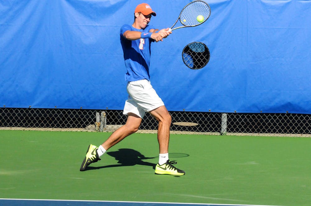<p>Alfredo Perez returns a serve&nbsp;during Florida's 6-1 win over Troy on Jan. 17, 2016, at the Ring Tennis Complex.</p>