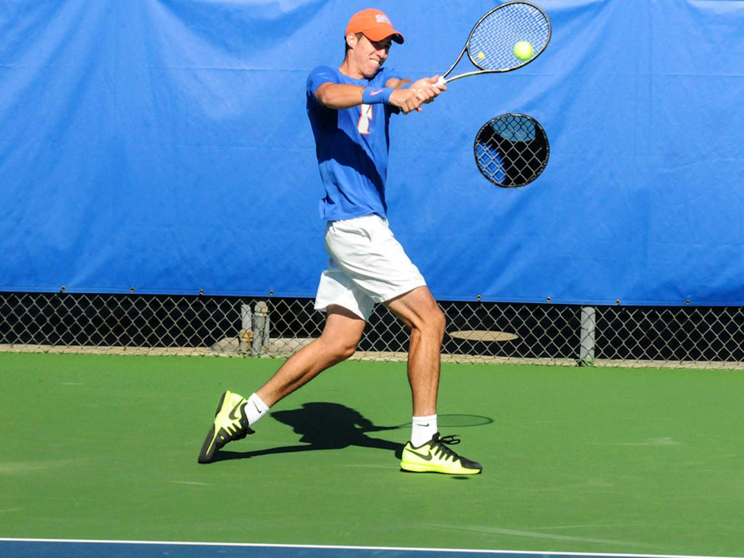 Alfredo Perez returns a serve during Florida's 6-1 win over Troy on Jan. 17, 2016, at the Ring Tennis Complex.
