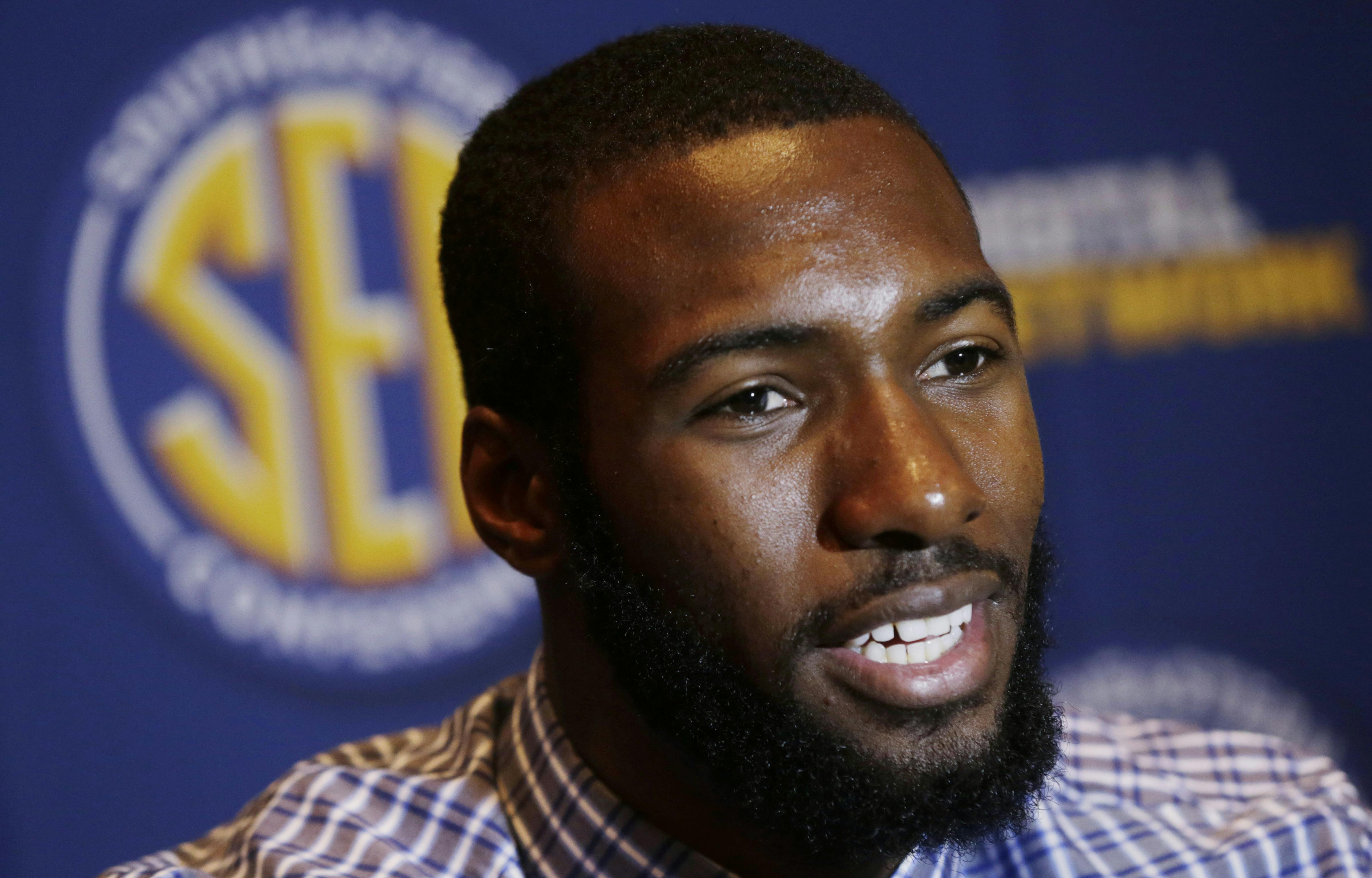 Senior center Patric Young talks with reporters during Southeastern Conference Basketball Media Days in Birmingham, Ala., on Thursday.