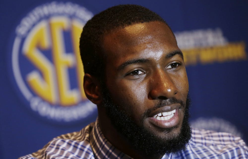 <p>Senior center Patric Young talks with reporters during Southeastern Conference Basketball Media Days in Birmingham, Ala., on Thursday.</p>