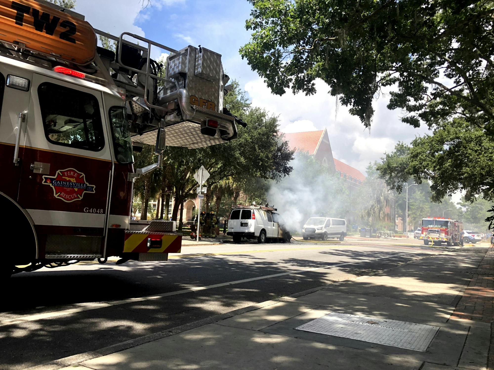 The Gainesville Fire Rescue arrives to extinguish flames from a burning vehicle Monday, Aug. 28, 2023.