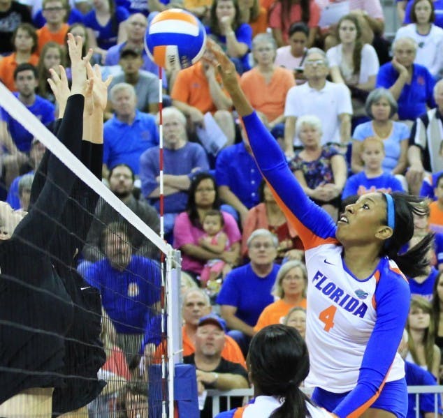 Senior Tangerine Wiggs spikes the ball over the net during a match against Missouri on Friday at Stephen C. O'Connell Center. The Gators defeated the Tigers 3-0.