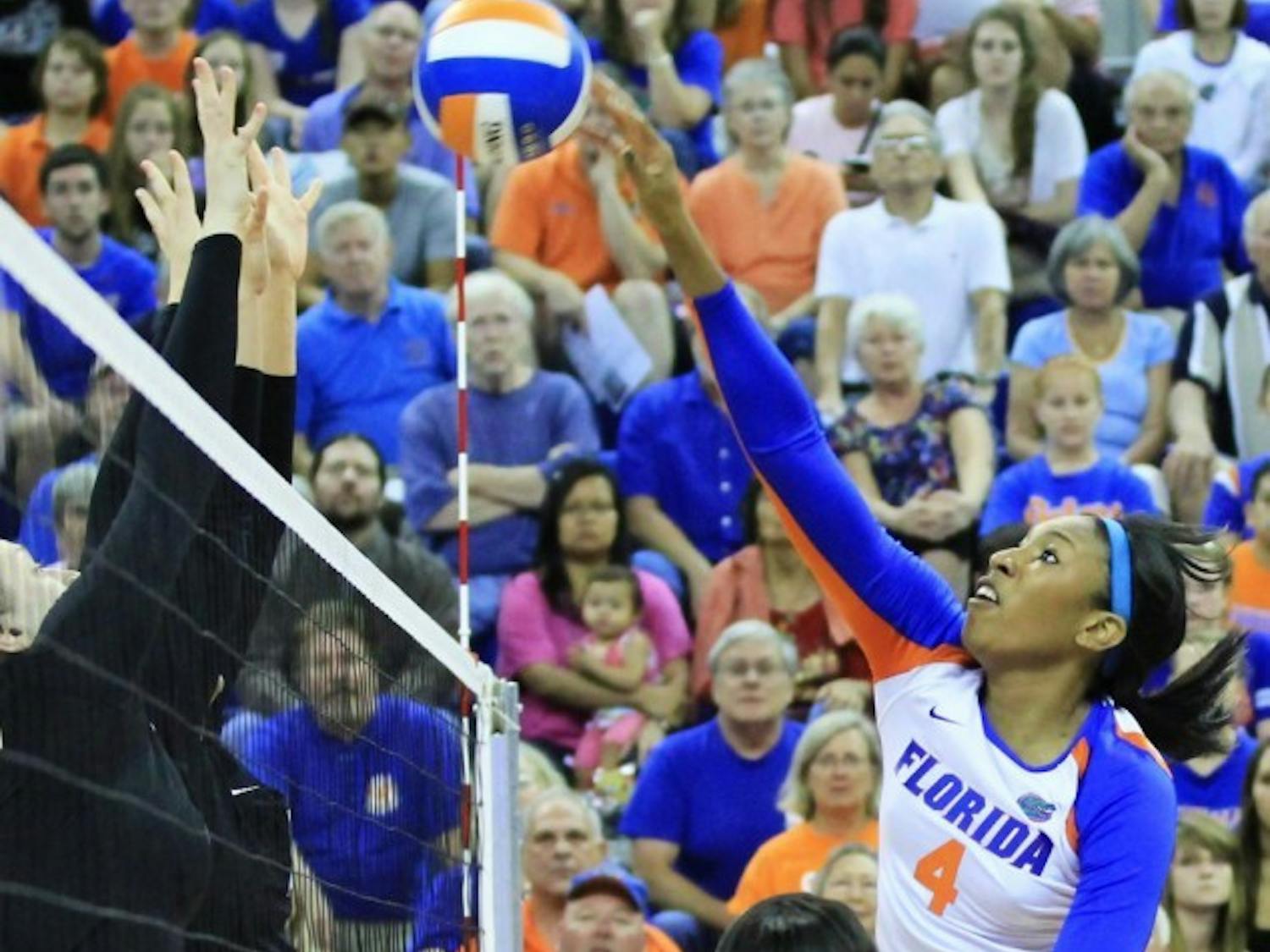 Senior Tangerine Wiggs spikes the ball over the net during a match against Missouri on Friday at Stephen C. O'Connell Center. The Gators defeated the Tigers 3-0.