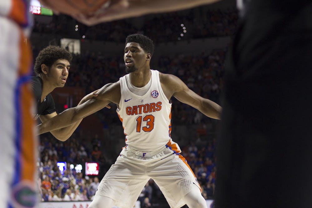<p>Kevarrius Hayes (13) plays defense in UF's 71-62 win against Texas A&amp;M on Feb. 11 in the O'Connell Center. </p>