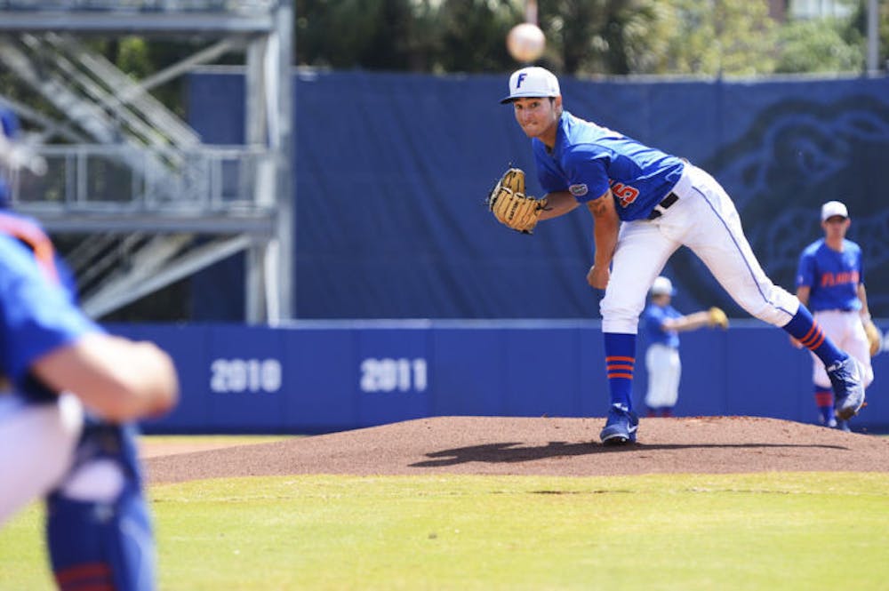 <p class="p1"><span class="s1">Freshman pitcher Danny Young warms up on the mound before Florida’s 4-0 victory against Ole Miss on March 31 at McKethan Stadium. Young picked up the loss in the Gators' 18-6 loss to the Tigers on Saturday.</span></p>