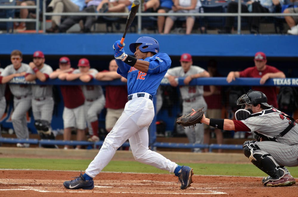 <p>UF's Richie Martin follows through on his swing during Florida's 12-5 win against the South Carolina Gamecocks on April 11, 2015 at McKethan Stadium.</p>