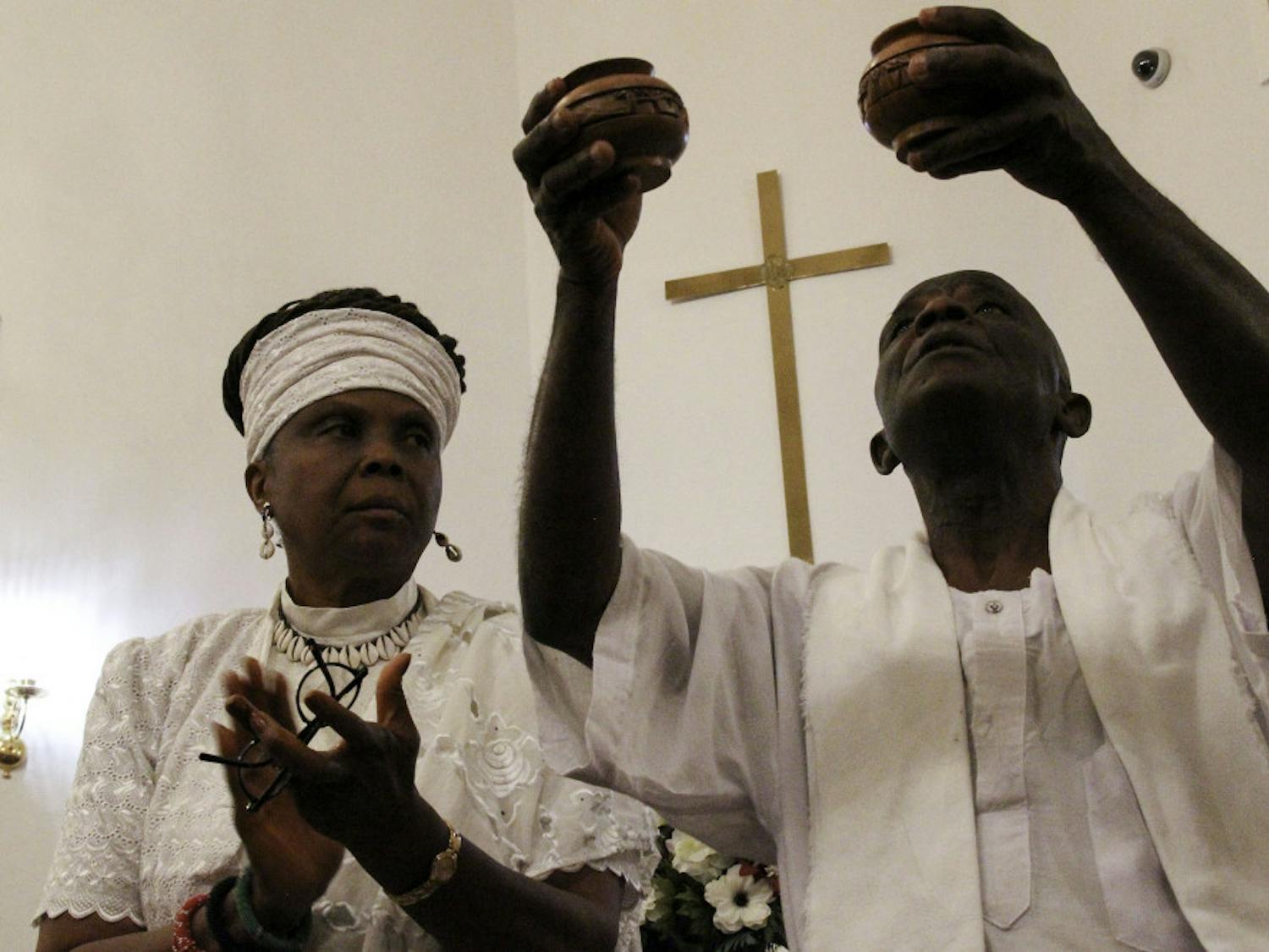 D. Ayoka Sowa-La and her husband, Nii Sowa-La, perform a drum libation, a spiritual ritual involving the pouring of drink as an offering to deities, during the Alachua County lynching memorial service at Mount Pleasant United Methodist Church Friday evening. 