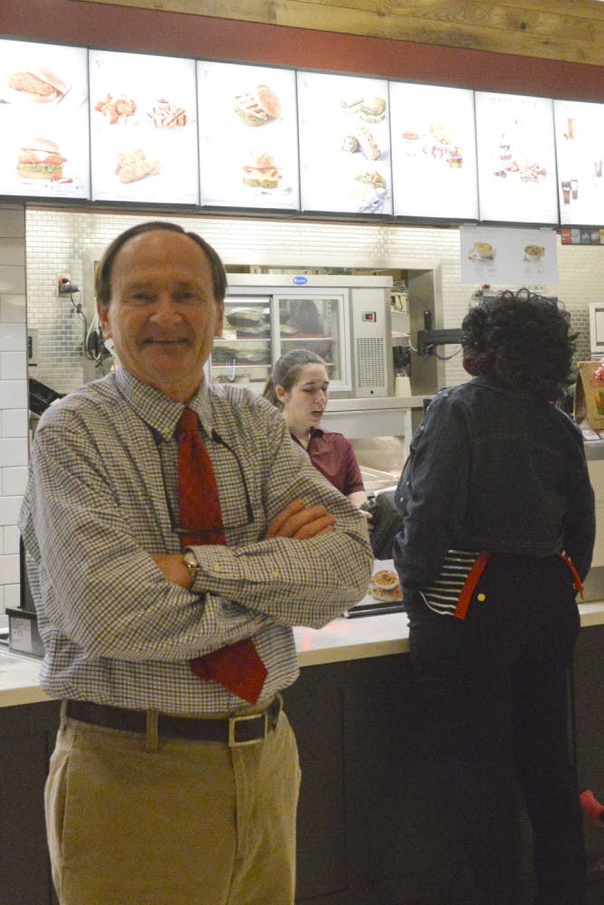 Steve Carroll, owner of the Oaks Mall’s last locally owned store, stands in Chick-fil-a and poses for a picture. Carroll’s restaurant opened in 1978 and was one of the mall’s original stores.