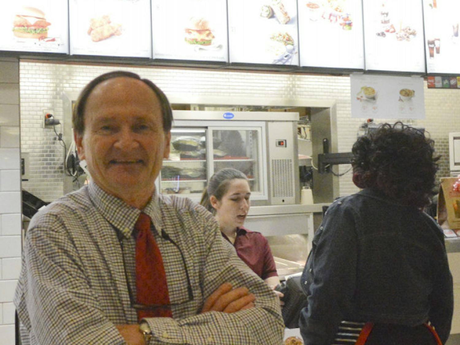 Steve Carroll, owner of the Oaks Mall’s last locally owned store, stands in Chick-fil-a and poses for a picture. Carroll’s restaurant opened in 1978 and was one of the mall’s original stores.