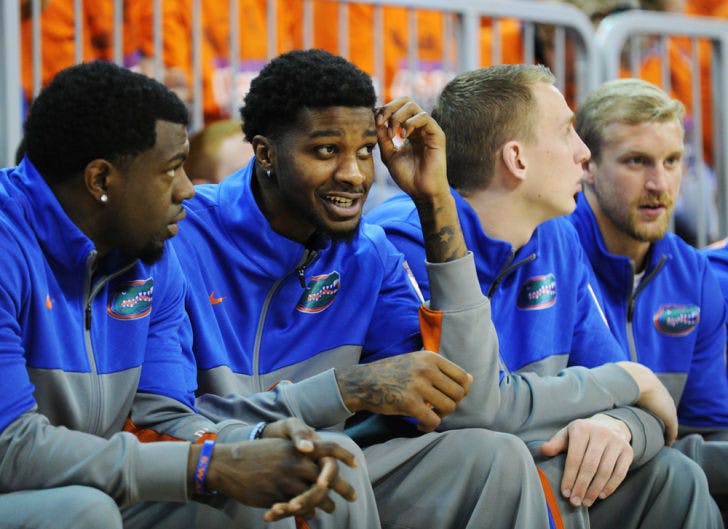 Chris Walker (second from left) looks on during Florida’s win against Tennessee on Saturday in the O’Connell Center.