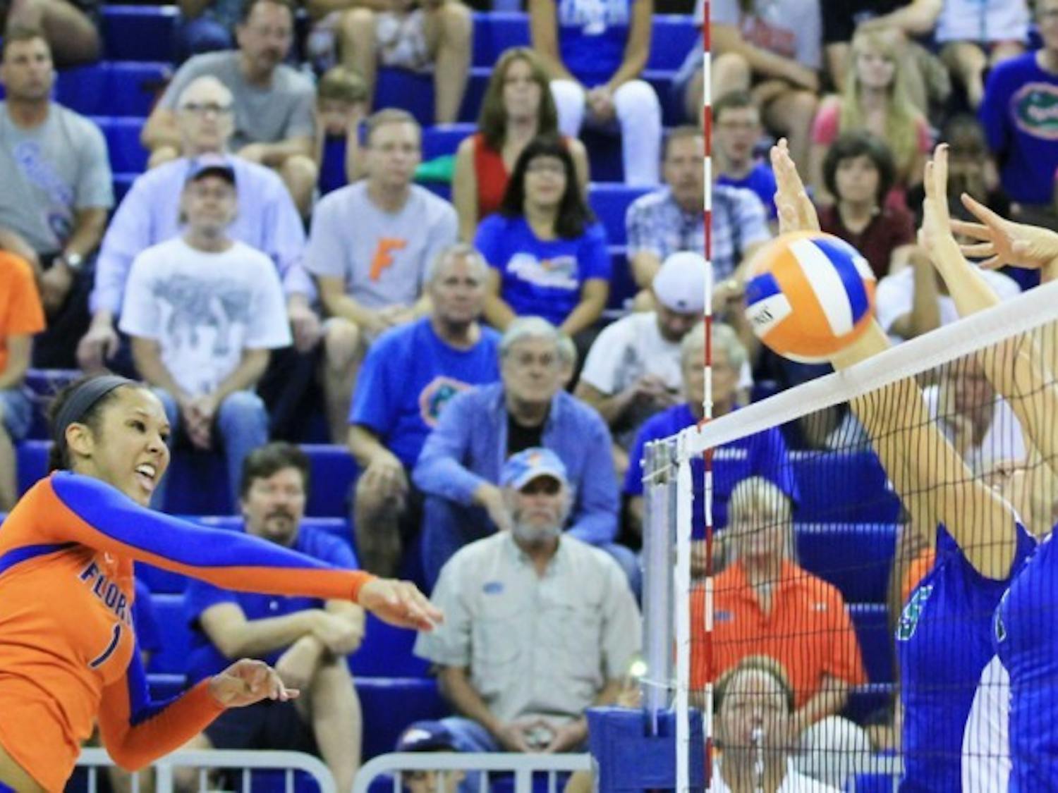 Freshman Berkley Whaley (1) spike the ball over the net during Florida's match against Florida Gulf Coast at the Stephen C. O'Connell Center on Aug. 25.
