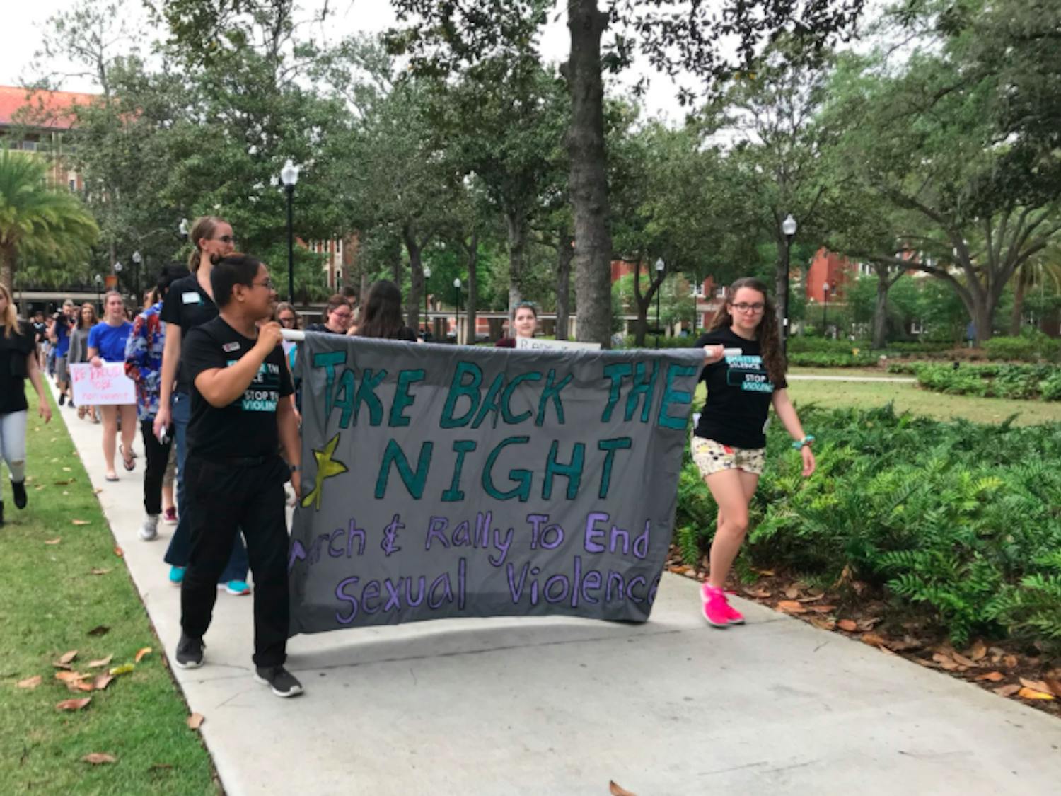 People march on Plaza of the Americas during Take Back The Night. 