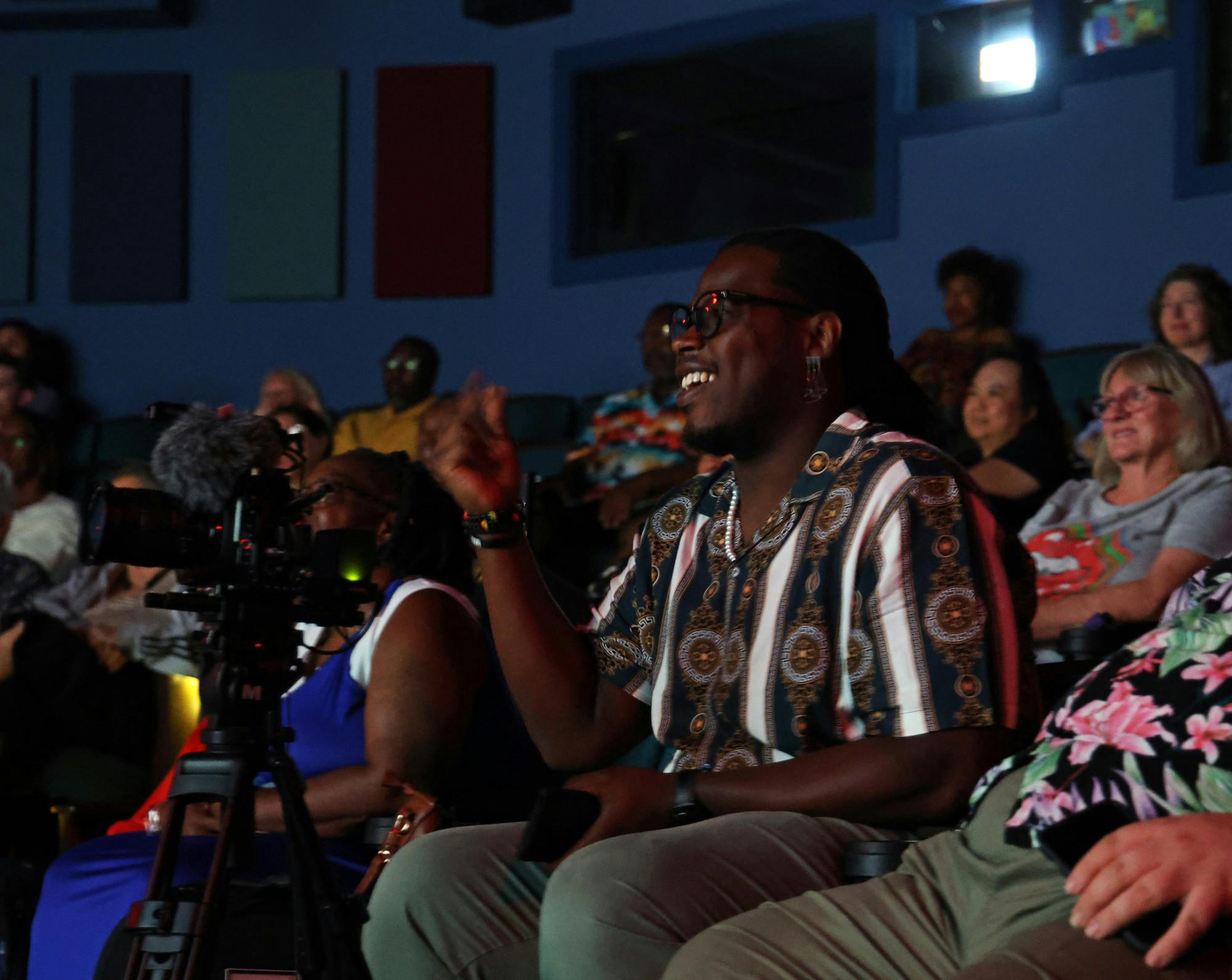Lorenza "Lo" Weaver snaps his fingers while watching "Bridging Troubled Waters: The Life of Coach Jessie Heard: Lincoln High and Buchholz High School" during the GNV Film Festival on Saturday, June 6, 2025. 