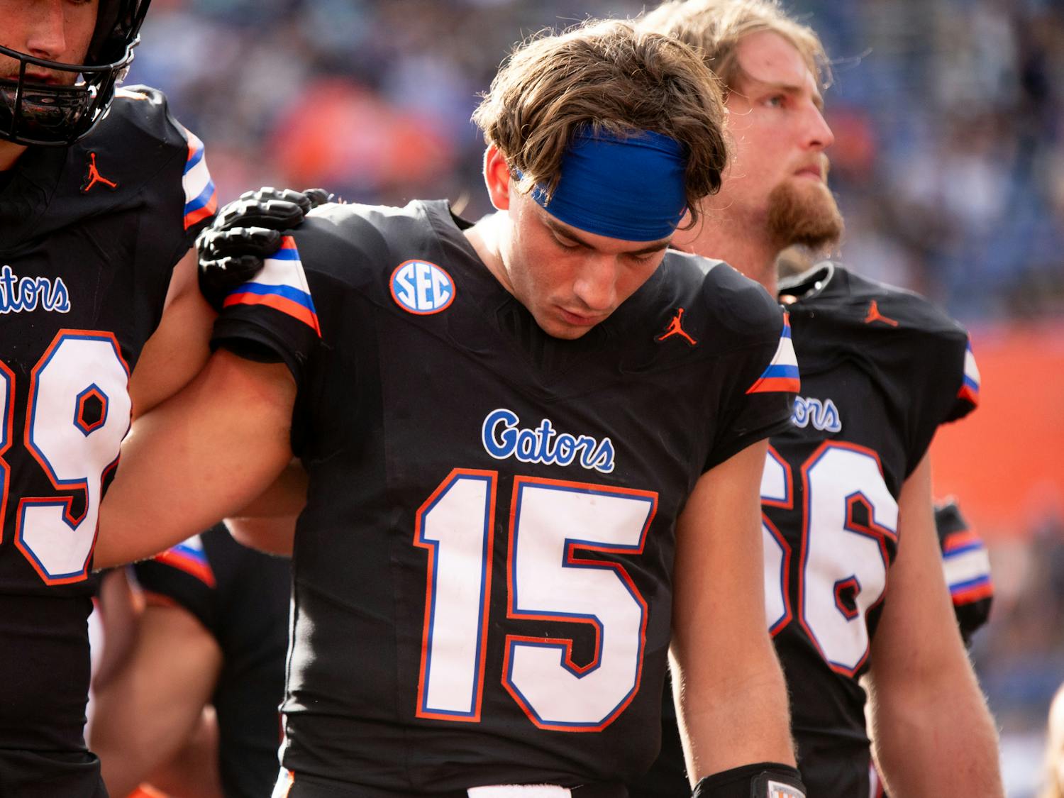 Redshirt junior quarterback Graham Mertz is embraced by his teammates in the Gators’ 39-36 loss to the Arkansas Razorbacks on Saturday, Nov. 4, 2023.
