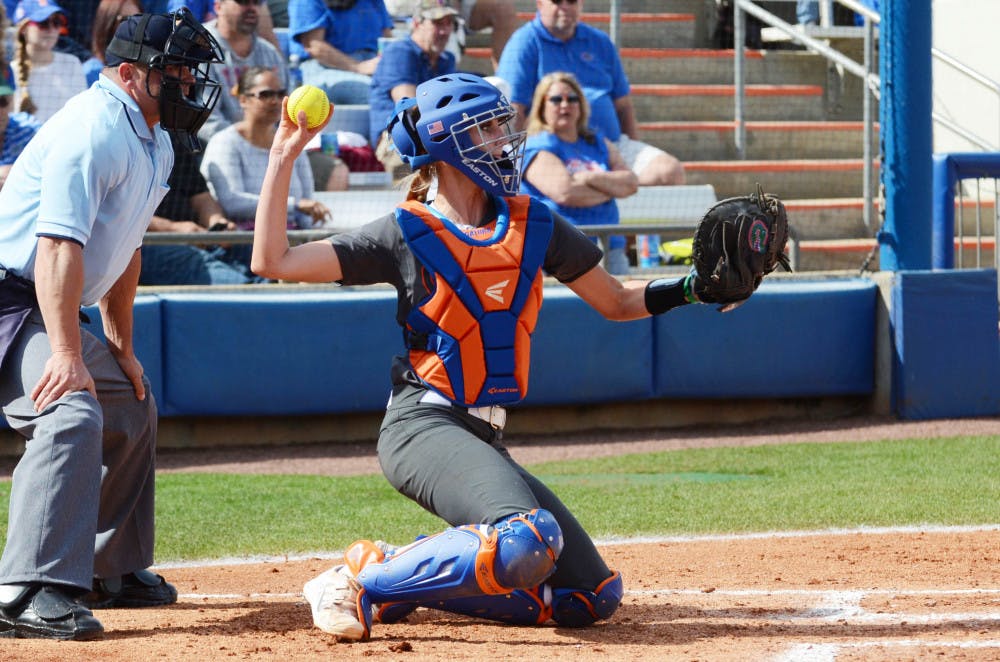 <p>Aubree Munro catches during Florida's 7-1 win against Kansas on Feb. 21 at Katie Seashole Pressly Stadium.</p>