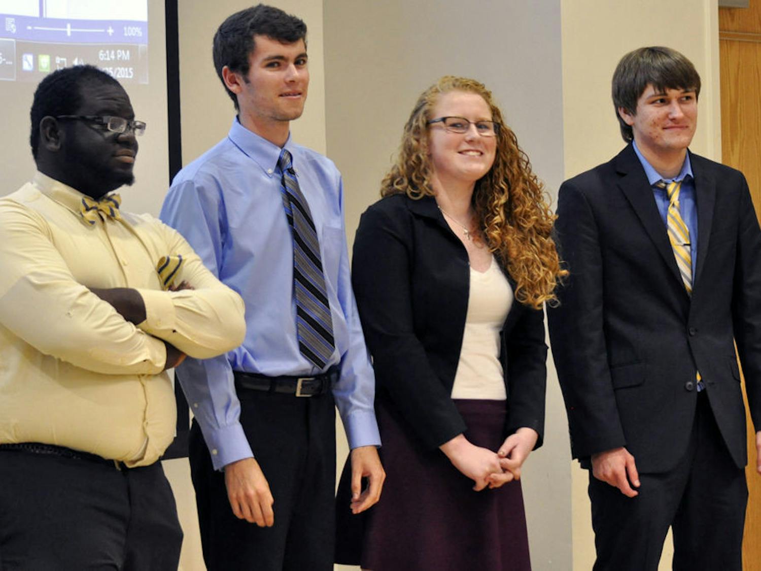 From left: Santa Fe Student Government Senator-elect Iyanuoluwa “Isreal” Okeowo poses for a photo with President-elect Conor Flynn, Vice-President-elect Hannah Gwynn and Treasurer-elect Justin Deese at the senate meeting on Wednesday.