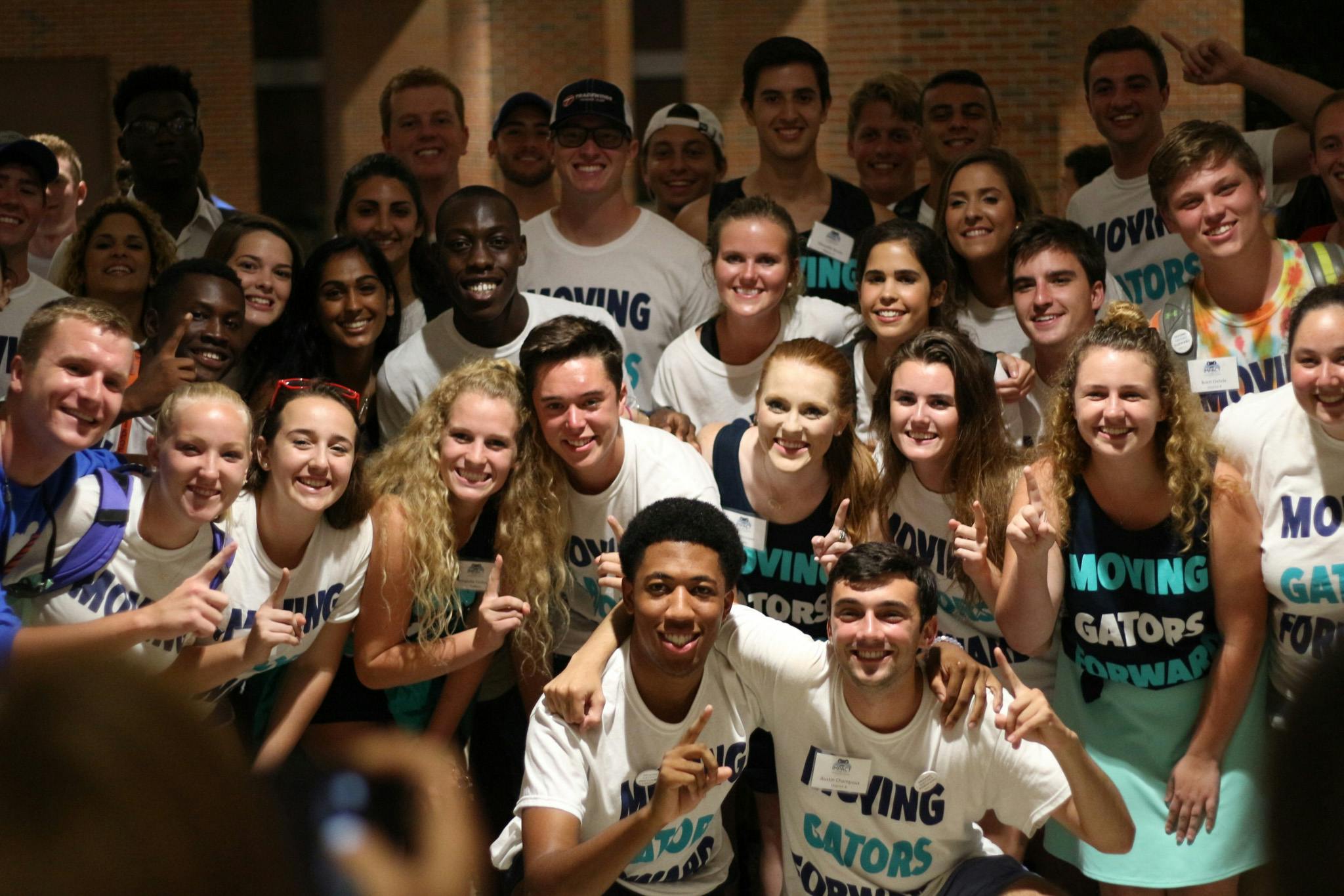 Impact Party candidates and supporters crowd the Reitz Union Breezeway on Wednesday to commemorate the election night with a picture. 