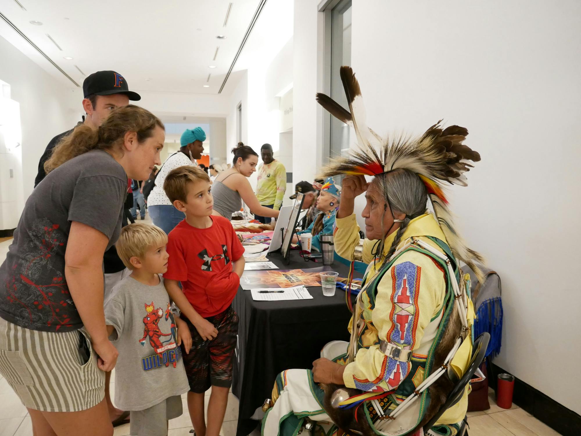 Duane Whitehorse, 76, explains the cultural significance of his garments during the Indigenous Peoples’ Week celebration at the Harn Museum of Art on Oct. 12, 2023.
