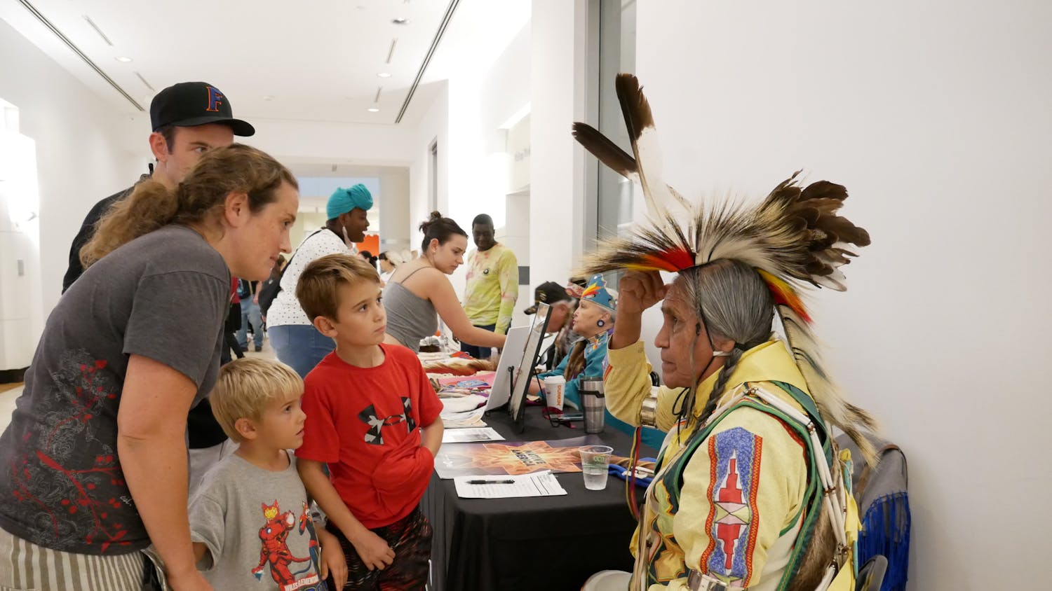 Duane Whitehorse, 76, explains the cultural significance of his garments during the Indigenous Peoples’ Week celebration at the Harn Museum of Art on Oct. 12, 2023.