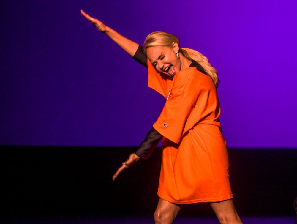 Kristin Chenoweth, the 50-year-old Emmy-winning and Tony award-winning actress and singer, performs a Gator Chomp Sunday evening while wearing a Florida Gators T-shirt during the beginning of her show at the Phillips Center for the Performing Arts. About 1,300 people watched as the Broadway star performed, sharing quirky personal anecdotes between songs.