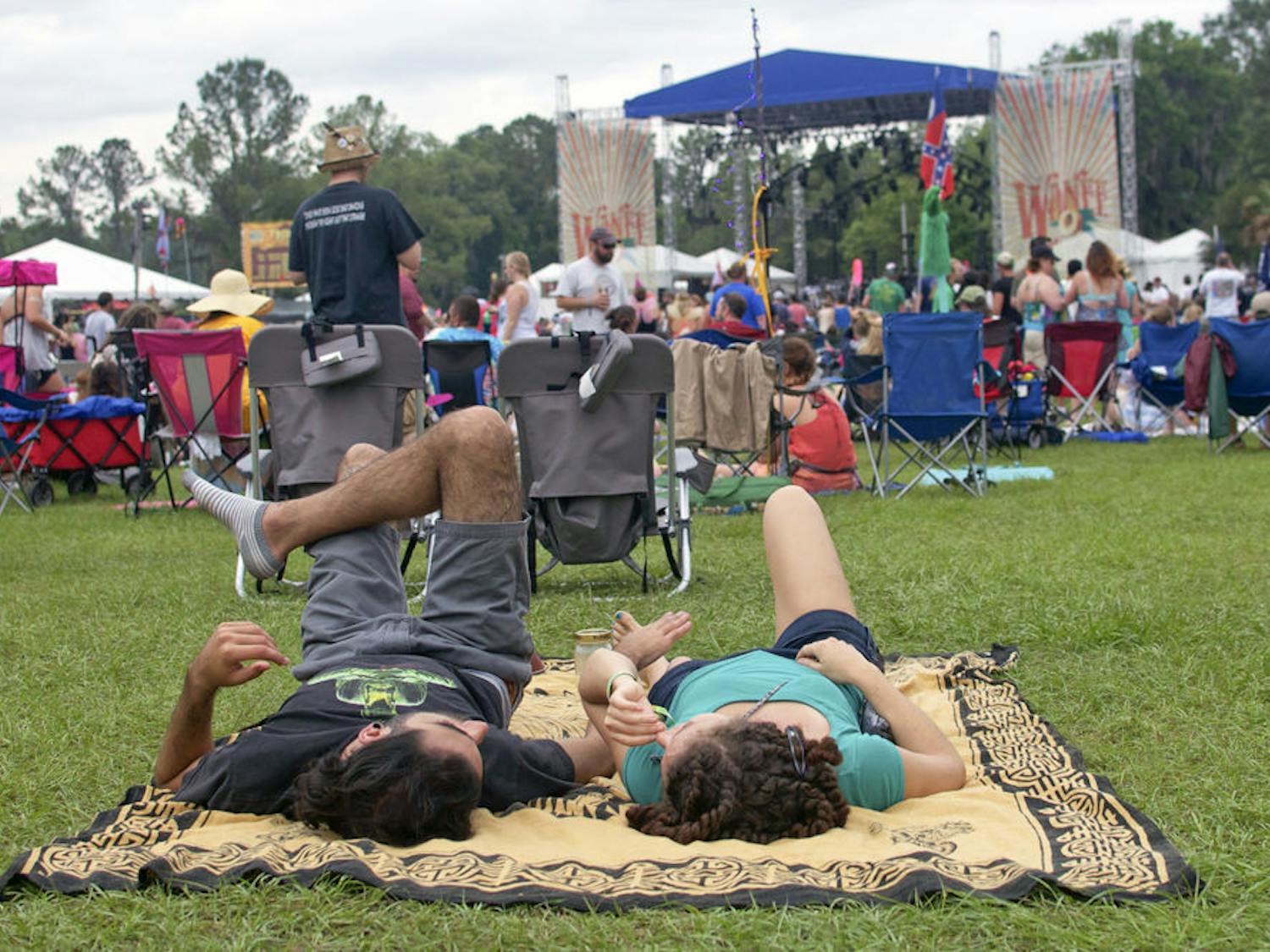 A pair of Wanee Music Festival attendees rest on their backs in between musical performances on Friday.