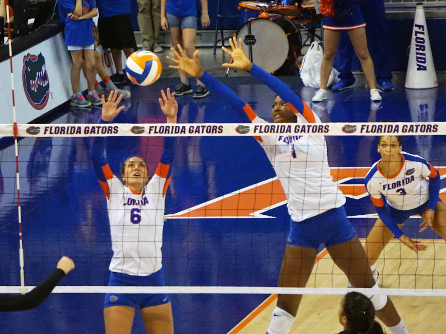 UF setter Mackenzie Dagostino (6) and middle blocker Rhamat Alhassan (1) jump for a block during Florida's 3-1 win on Sept. 20, 2015, in the O'Connell Center.