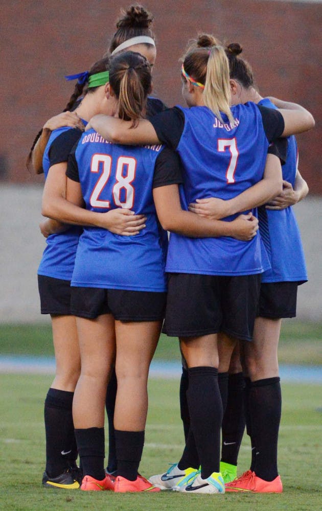 Florida's starters huddle prior to their 3-1 win against Georgia.