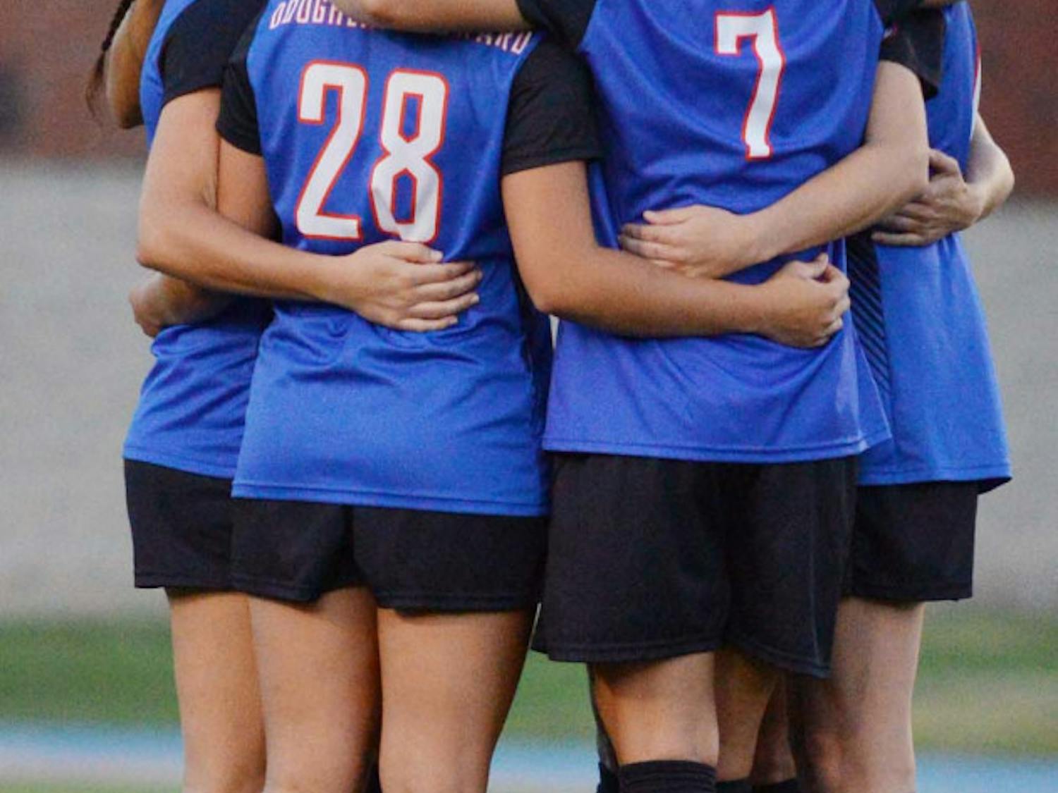 Florida's starters huddle prior to their 3-1 win against Georgia.