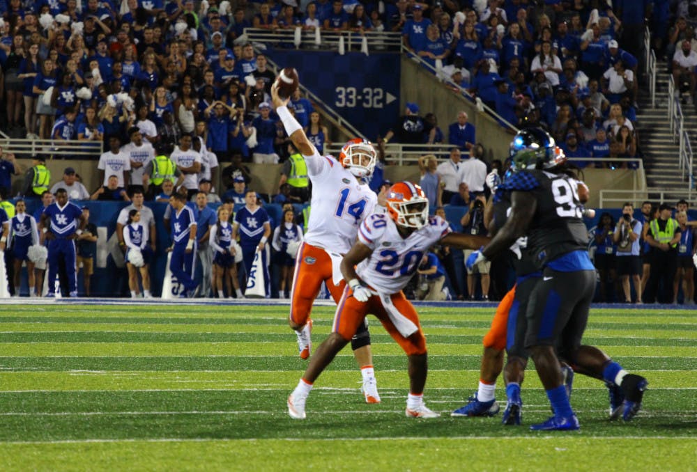 <p>Luke Del Rio throws a pass during Florida's 28-27 win over Kentucky on Saturday night at Kroger Field.</p>