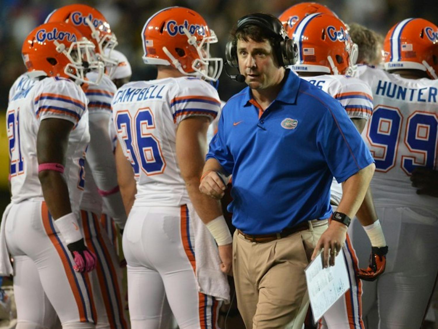 Coach Will Muschamp walks toward the sideline after a timeout against Vanderbilt on Saturday. Florida erased a first quarter deficit en route to a 16-point victory.