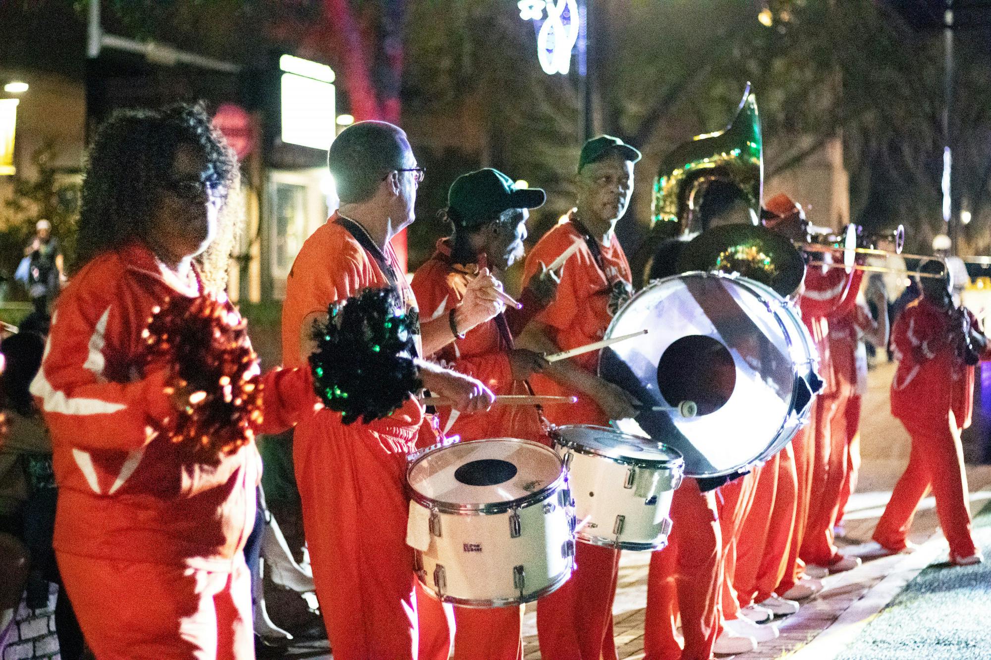 Members of the Richard E. Parker Alumni Band of Eastside High School perform across Bo Diddley Plaza Friday, Feb. 10, 2023.