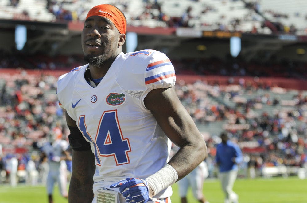 UF defensive lineman Alex McCalister walks off the field after warmups prior to Florida's 24-14 win against South Carolina on Nov. 14, 2015, in Columbia, South Carolina.