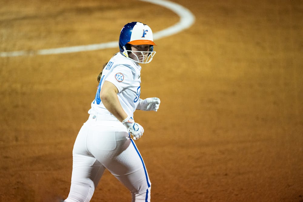 Florida Gators first basewomen and relief pitcher Ava Brown (00) looks back at the North Florida dugout while jogging to first base in a game against North Florida on Feb. 6, 2025.