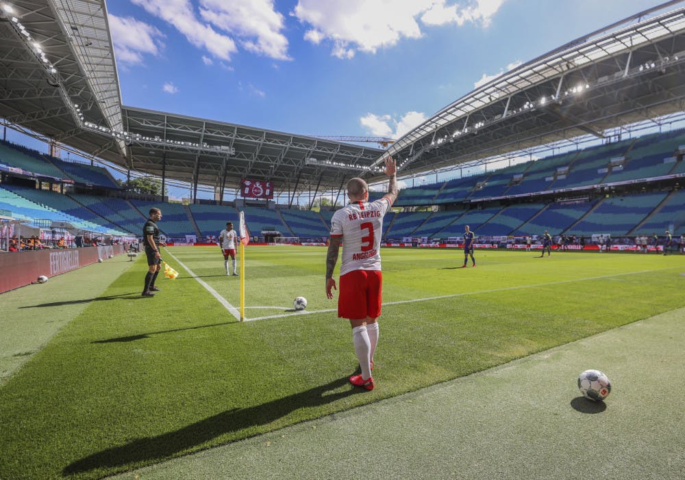 Leipzig's Angelino gestures before taking a corner during the German Bundesliga soccer match between RB Leipzig and SC Freiburg in Leipzig, Germany, Saturday, May 16, 2020. The German Bundesliga becomes the world's first major soccer league to resume after a two-month suspension because of the coronavirus pandemic. (Jan Woitas/dpa via AP)