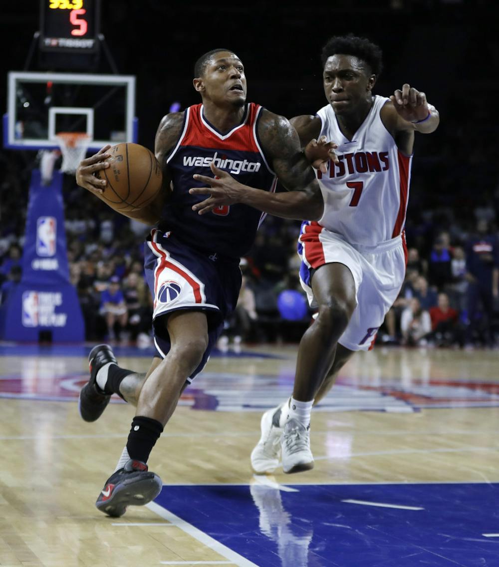 <p>Washington Wizards guard Bradley Beal (3) drives on Detroit Pistons forward Stanley Johnson (7) during second half of an NBA basketball game, Monday, April 10, 2017, in Auburn Hills, Mich. (AP Photo/Carlos Osorio)</p>