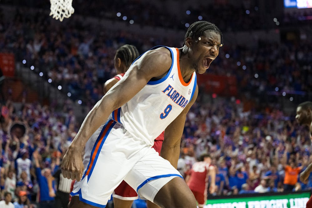 Florida Gators center Rueben Chinyelu (9) screams at the Oklahoma bench after a dunk in a basketball game on Tuesday, Feb. 18, 2025, in Gainesville, Fla.