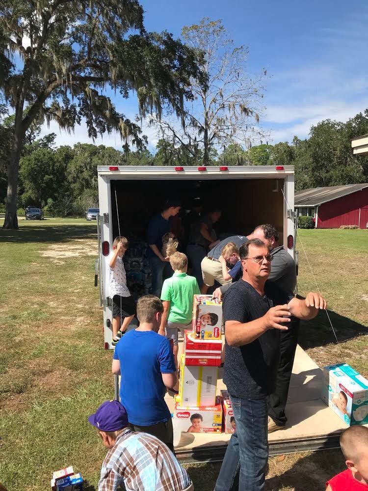 Members of Anthem Church partner with Concept Companies to fill a 24-foot trailer with donations of food, water, fuel and other resources to be delivered in the Panhandle.