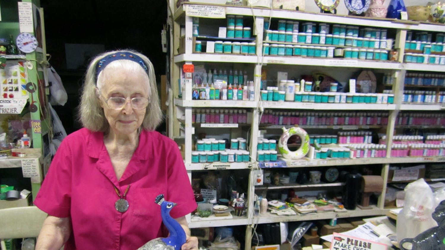 Juanita Frazier, 85, shows a ceramic peacock she repaired and painted herself. She has owned Frazier Ceramic Shop, 8601 SW Williston Road, since 1971 after moving back to Alachua County. 