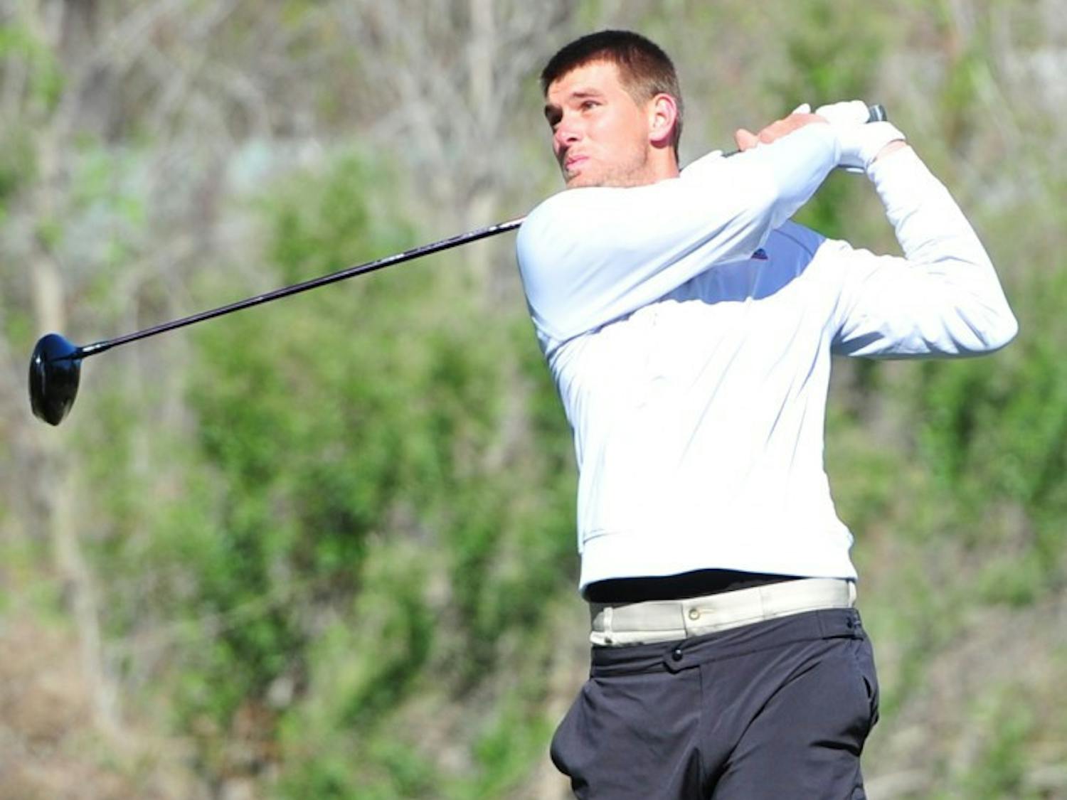 T.J. Vogel watches one of his drives during a tournament last spring. Vogel will begin competition at The Masters today.