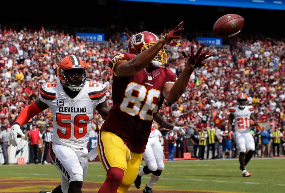 <p>Washington Redskins tight end Jordan Reed (86) catches a touchdown pass in front of Cleveland Browns inside linebacker Demario Davis (56) during the first half of an NFL football game Sunday, Oct. 2, 2016, in Landover, Md. (AP Photo/Chuck Burton)</p>