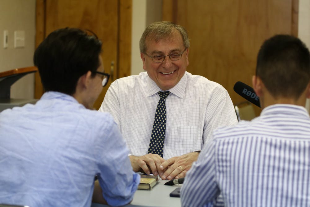 Lucas Zhou, a 21-year-old UF business senior, Angel Gonzalez, 22-year-old UF political science senior sit down in a room at Paschal’s Coffeehouse to record the student-run podcast “The Educational Espresso” with UF President Kent Fuchs. 