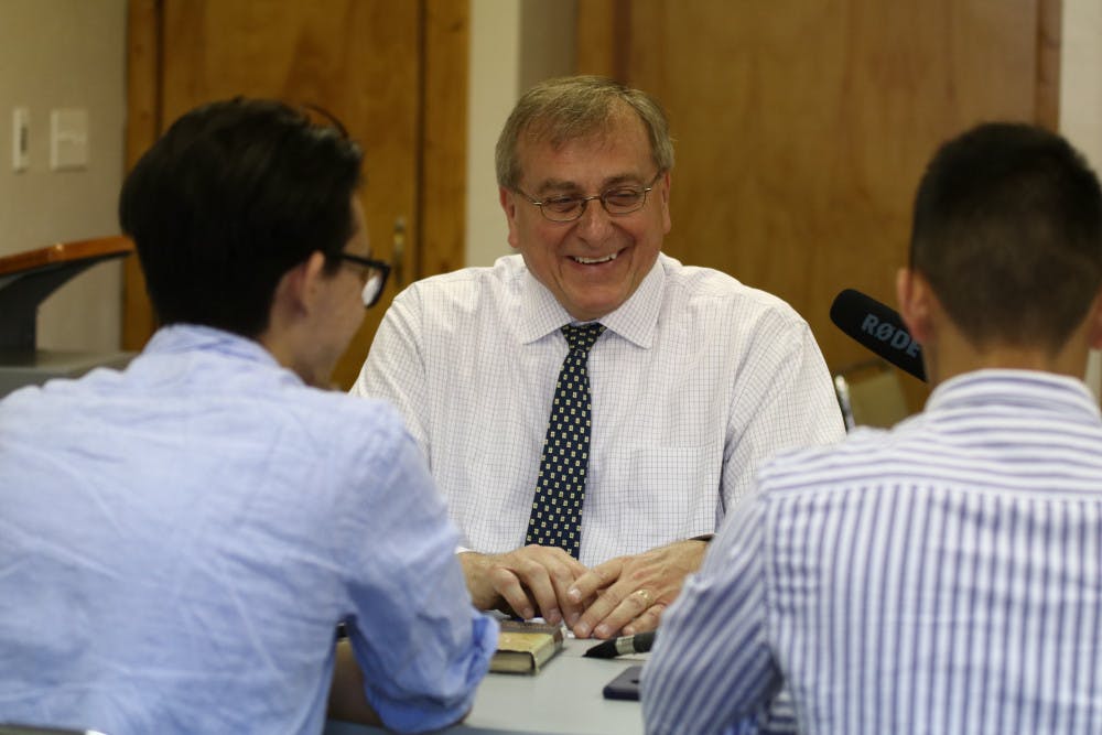 <p><span>Lucas Zhou, a 21-year-old UF business senior, Angel Gonzalez, 22-year-old UF political science senior sit down in a room at Paschal’s Coffeehouse to record the student-run podcast “The Educational Espresso” with UF President Kent Fuchs. </span></p>