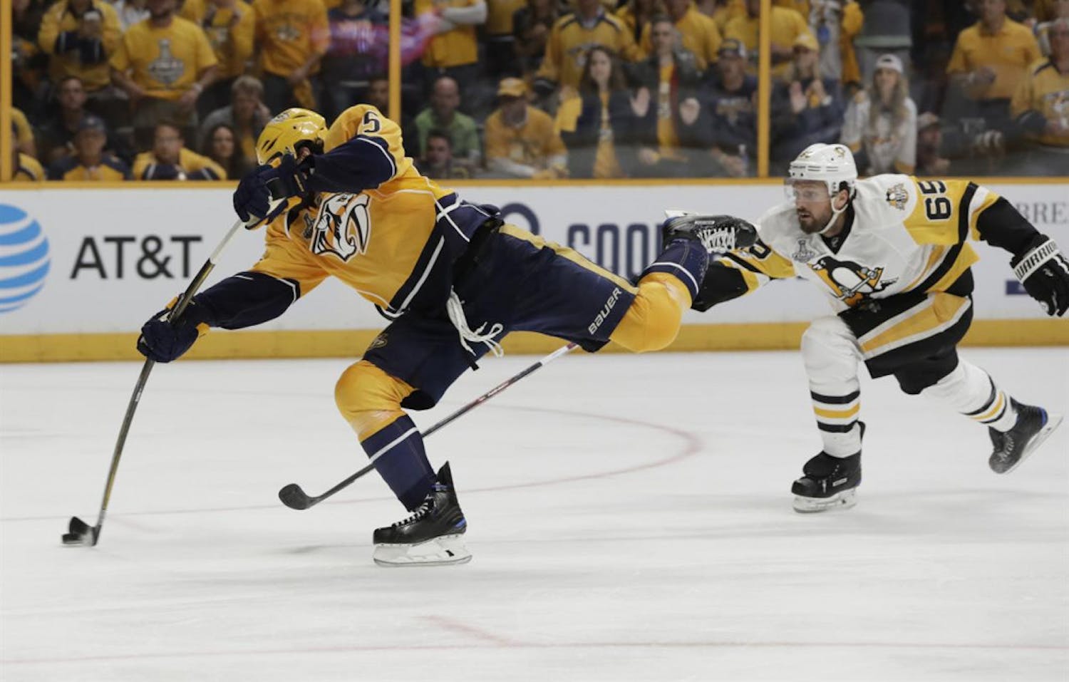 Nashville Predators right wing Craig Smith (left) shoots during the third period of game three in the Stanley Cup Finals on Saturday in Nashville, Tennessee.